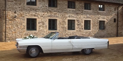 Hochzeitsauto-Vermietung - Nordrhein-Westfalen - Cadillac de Ville Hochzeitsauto Cabriolet - weiß Ruhrgebiet - Brautauto - Cadillac Weddingcar - Hochzeitsauto & Fotografie
