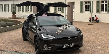 Hochzeitsauto-Vermietung - Art des Fahrzeugs: Elektro-Fahrzeug - unser schwarzes Model X (2017) - Tesla Model X mit einzigartigen Flügeltüren in Spacegry 